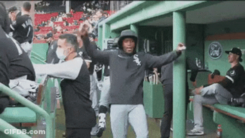A Baseball Player Wearing A White Sox Hoodie Is Dancing In The Dugout GIF