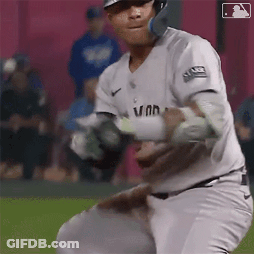 A Baseball Player Wearing A White Uniform With The Word Van On It GIF