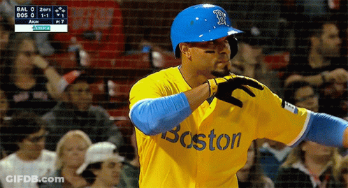 A Baseball Player Wearing A Yellow And Blue Boston Jersey GIF