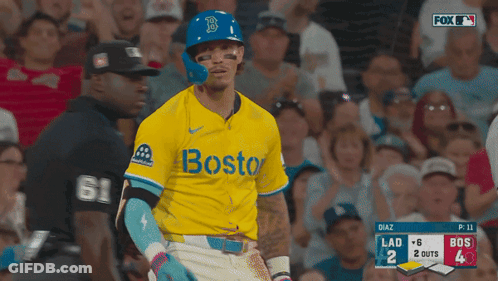 A Baseball Player Wearing A Yellow Jersey With The Word Boston On The Front GIF