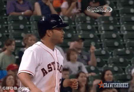 A Baseball Player Wearing An Astros Jersey Is Standing In Front Of A Crowd GIF
