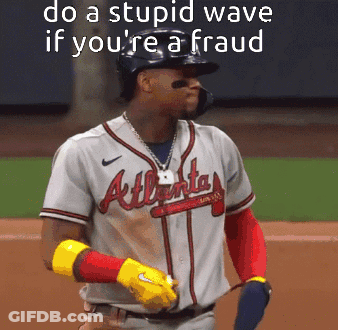 A Baseball Player Wearing An Atlanta Braves Jersey Stands On The Field GIF