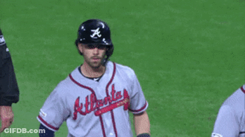 A Baseball Player Wearing An Atlanta Jersey Stands On The Field GIF