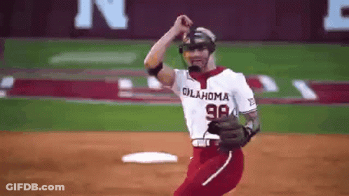 A Baseball Player Wearing An Oklahoma Jersey Is Standing On The Field GIF