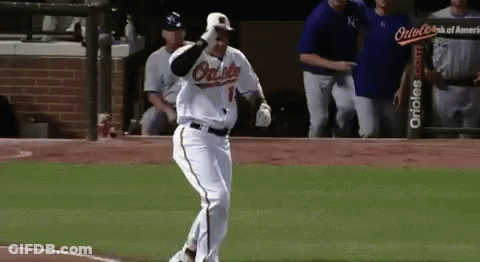 A Baseball Player Wearing An Orioles Uniform Is Running On The Field . GIF