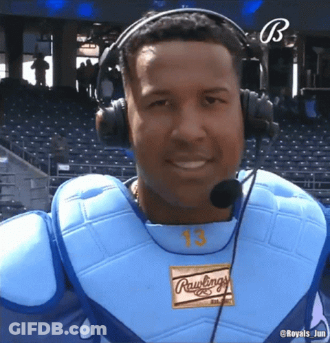 A Baseball Player Wearing Headphones And A Rawlings Shirt GIF