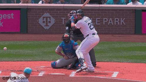 A Baseball Player Wearing Number 22 Swings At A Pitch GIF