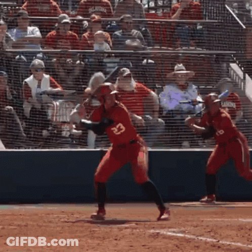 A Baseball Player Wearing Number 23 Is Swinging At A Pitch GIF
