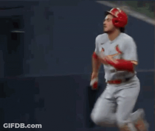 A Baseball Player Wearing Number 28 Is Running Towards Home Plate GIF