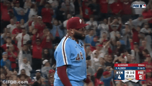 A Baseball Player Wearing Number 46 Stands In Front Of A Crowd GIF