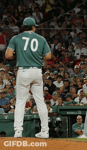 A Baseball Player Wearing Number 70 Stands On The Mound GIF