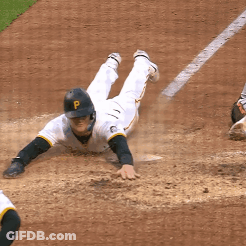 A Baseball Player With A P On His Helmet Slides Into Base GIF