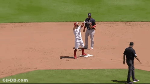 A Baseball Player With The Letter A On His Jersey Is Standing On The Base GIF