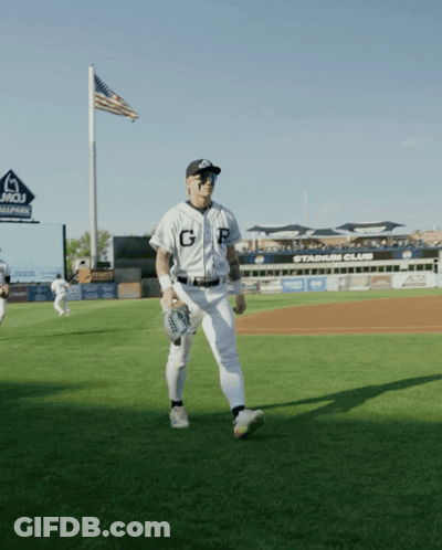 A Baseball Player With The Letter G On His Jersey Stands On A Field GIF