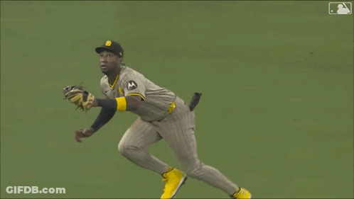 A Baseball Player With The Letter S On His Hat Is Laying On The Grass GIF