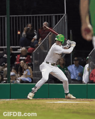 A Baseball Player With The Letter S On His Helmet Swings At A Pitch GIF