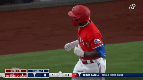 A Baseball Player With The Letter T On His Helmet Is Running On The Field GIF