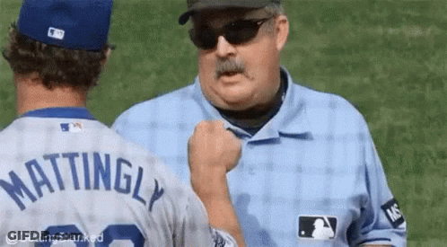 A Baseball Player With The Name Mattingly On His Shirt GIF