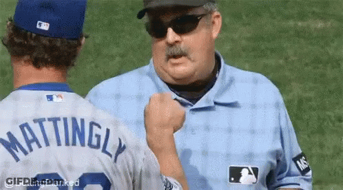 A Baseball Player With The Name Mattingly On The Back Of His Shirt GIF