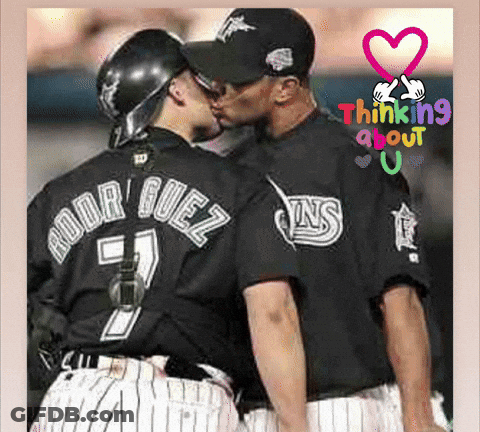 A Baseball Player With The Name Rodriguez On His Back Kisses Another Player GIF