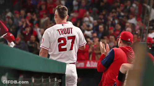 A Baseball Player With The Name Trout On The Back Of His Shirt GIF