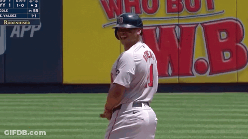 A Baseball Player With The Number 1 On His Jersey Stands On The Field GIF
