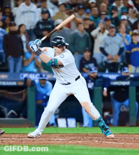 A Baseball Player With The Number 10 On His Jersey Getting Ready To Swing His Bat GIF