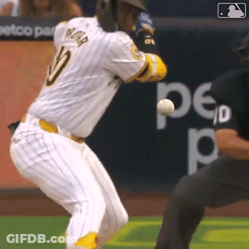 A Baseball Player With The Number 10 On His Jersey Is Swinging At A Ball GIF