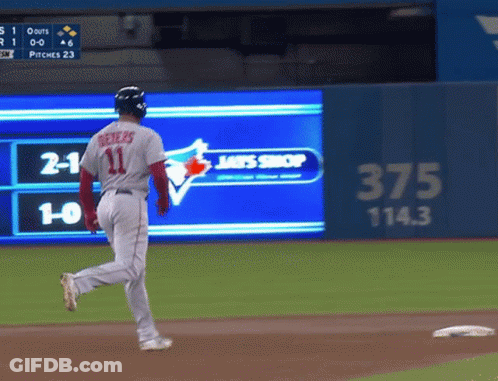 A Baseball Player With The Number 11 On His Jersey Is Running GIF