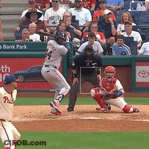 A Baseball Player With The Number 14 On His Jersey Swings His Bat GIF