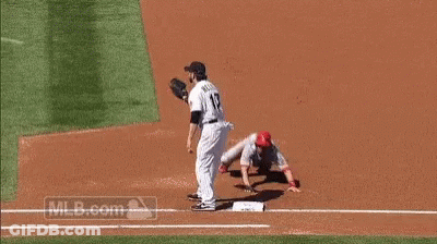 A Baseball Player With The Number 17 On His Jersey Is Trying To Catch A Ball . GIF