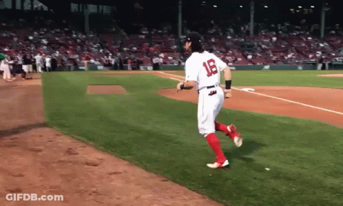 A Baseball Player With The Number 18 On His Jersey Is Running On The Field GIF