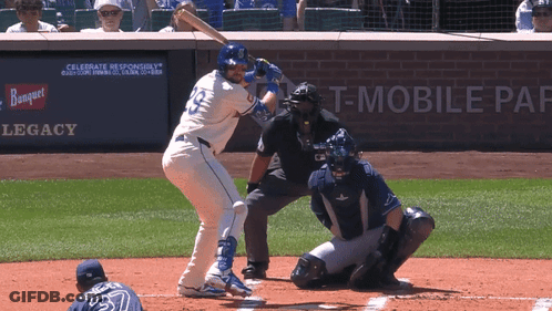 A Baseball Player With The Number 19 On His Jersey Is Swinging At A Pitch GIF