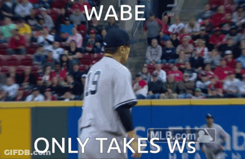 A Baseball Player With The Number 19 On His Jersey Stands On The Field GIF