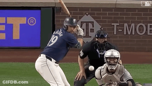 A Baseball Player With The Number 19 On His Jersey Swings At A Ball GIF