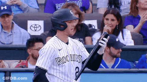 A Baseball Player With The Number 2 On His Jersey Is Holding A Bat . GIF