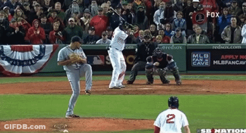 A Baseball Player With The Number 2 On His Jersey Swings At A Pitch GIF