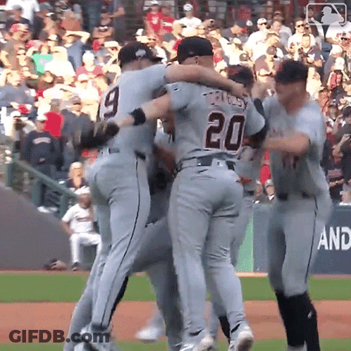 A Baseball Player With The Number 20 On His Back Is Hugging Another Player GIF