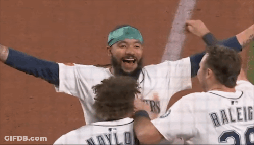 A Baseball Player With The Number 20 On His Back Is Hugging Another Player GIF