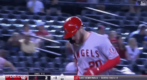 A Baseball Player With The Number 20 On His Jersey Is Running GIF