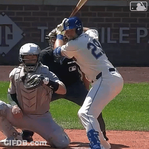 A Baseball Player With The Number 20 On His Jersey Is Swinging His Bat GIF