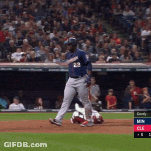 A Baseball Player With The Number 22 On His Jersey Is Running Towards Home Plate GIF