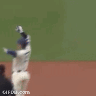 A Baseball Player With The Number 22 On His Jersey Is Standing On The Field GIF