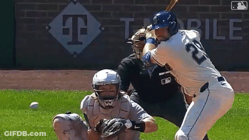 A Baseball Player With The Number 22 On His Jersey Is Swinging A Bat GIF