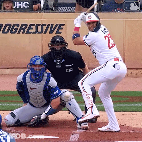 A Baseball Player With The Number 22 On His Jersey Swings At A Pitch GIF