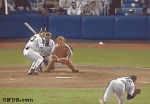A Baseball Player With The Number 23 On His Jersey Is Swinging At A Pitch GIF