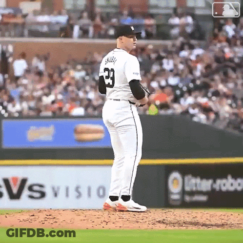 A Baseball Player With The Number 23 On His Jersey Stands On The Mound GIF