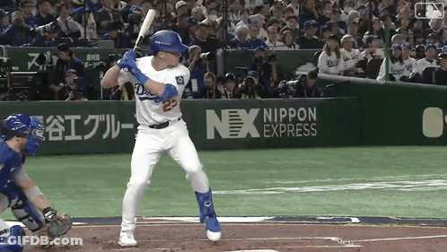 A Baseball Player With The Number 23 On His Jersey Swings At A Ball GIF