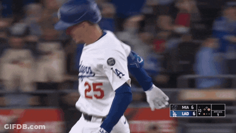 A Baseball Player With The Number 25 On His Jersey Is Running GIF
