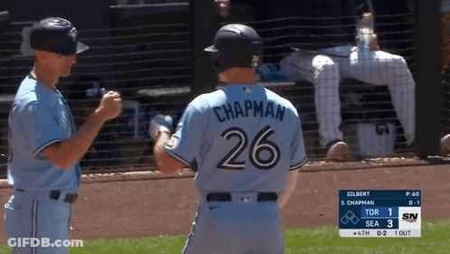 A Baseball Player With The Number 26 On His Back Shakes Hands With Another Player GIF